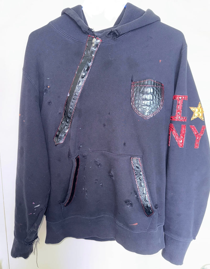 I Star in NY Hoodie showcasing vegan leather accents and a unique distressed design.
